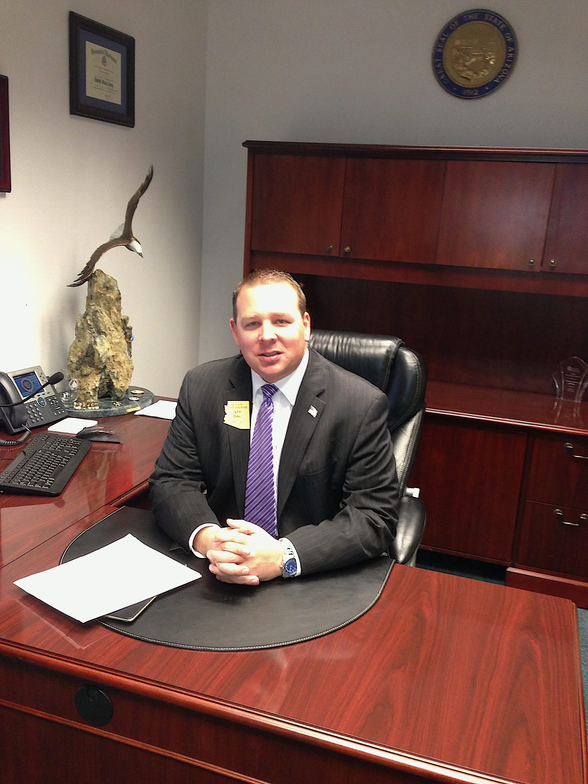 Representative Jeff Dial seated at his desk in his office at the Arizona State Capitol